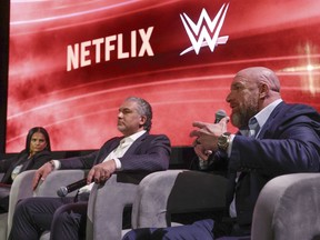 From left, Netflix Chief Content Officer Bela Bajaria, WWE President Nick Khan and WWE Chief Content Officer Paul "Triple H" Levesque discuss the World Wrestling Entertainment and Netflix during an event at Netflix's headquarters in Los Angeles on Dec. 3, 2024.