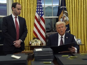 President Donald Trump signs executive orders