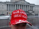 A Donald Trump supporter from Alabama wears a Make America Great Again hat in the snow on Sunday in Washington, DC.