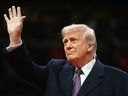U.S. President Donald Trump waves as he arrives at the inaugural parade inside Capitol One Arena in Washington, D.C., on Jan. 20.