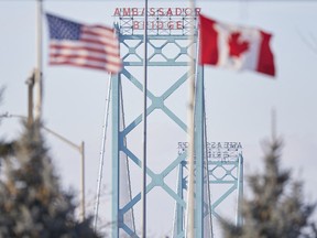 American and Canadian flags at the Ambassador Bridge border crossing in Windsor, Ont.