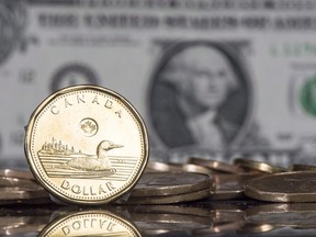 The Canadian dollar coin is displayed next to the U.S. dollar.