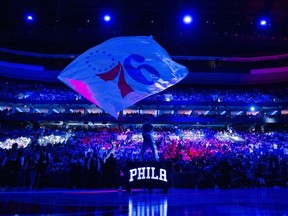 FILE - Philadelphia 76ers mascot Franklin waves the flag during pre-game introductions prior to the NBA basketball game against the Brooklyn Nets, April 14, 2024, in Philadelphia.