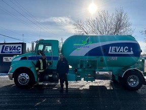 President Christian Levac and Propane Levac's pioneer driver, Réjean Bergevin, stand beside the truck wrapped with the renewable propane logo in preparation for the historic event on Monday, January 27, 2025.