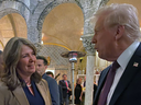 Alberta Premier Danielle Smith speaks with Donald Trump at his Mar-a-Lago resort over the weekend.