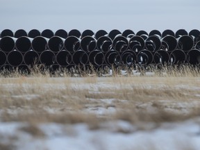 Pipes for the Keystone XL pipeline stacked in a yard near Oyen, Alberta, Canada, on Jan. 26, 2021.