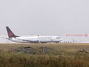 An Air Canada 737 Max 8 jet takes off at Calgary International Airport.