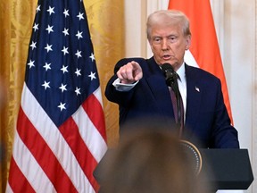 U.S. President Donald Trump takes questions during a joint press conference with unseen Indian Prime Minister Narendra Modi in the East Room of the White House in Washington, D.C., on February 13, 2025.