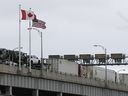 Commercial trucks cross the Lewiston-Queenston Bridge border crossing into the United States on Feb. 04, 2025 in Niagara Falls, Canada.