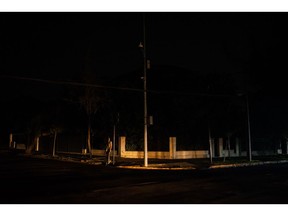 A pedestrian on a street during a power outage in Santiago, Chile, on Tuesday, Feb. 25, 2025. Photographer: Cristobal Olivares/Bloomberg
