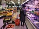 A woman shops in a grocery store in Toronto, Ont.