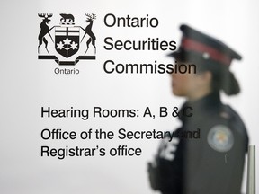 A Toronto Police Services officer at the Ontario Securities Commission in Toronto, Ont.