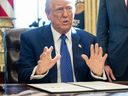 United States President Donald Trump speaks after signing an executive order in the Oval Office of the White House in Washington, D.C.
