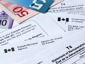 Canada Revenue Agency income tax forms and statements to prepare taxes.