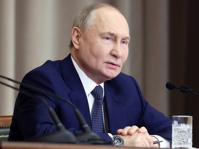 Russia's President Vladimir Putin attending a meeting at the Supreme Court in Moscow on Feb. 20.