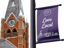 A banner encouraging people to 'love local' near Belleville City Hall in Belleville, Ont.