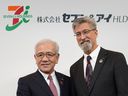 Seven & i Holdings President Ryuichi Isaka and outside director Stephen Dacus, who is appointed as president, pose for the media during a photo session following their press conference at the company's head office in Tokyo on March 6, 2025.