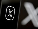 This illustration photograph shows the logo of social network X (formerly Twitter) displayed on a smartphone in Brussels on Sept. 27, 2024.