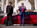 U.S. President Donald Trump, accompanied by White House Senior Advisor, Tesla and SpaceX CEO Elon Musk, speaks next to a Tesla Model S on the South Lawn of the White House on March 11, 2025 in Washington, DC.