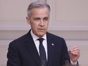 Prime Minister Mark Carney attends a joint statement with French President Emmanuel Macron Monday, March 17, 2025 at the Elysee Palace in Paris.