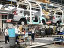 Honda employees work along the vehicle assembly line in Alliston, Ont., on April 25, 2024.