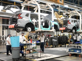 Honda employees worked along the vehicle assembly line in Aliston, Ontario on April 25, 2024.
