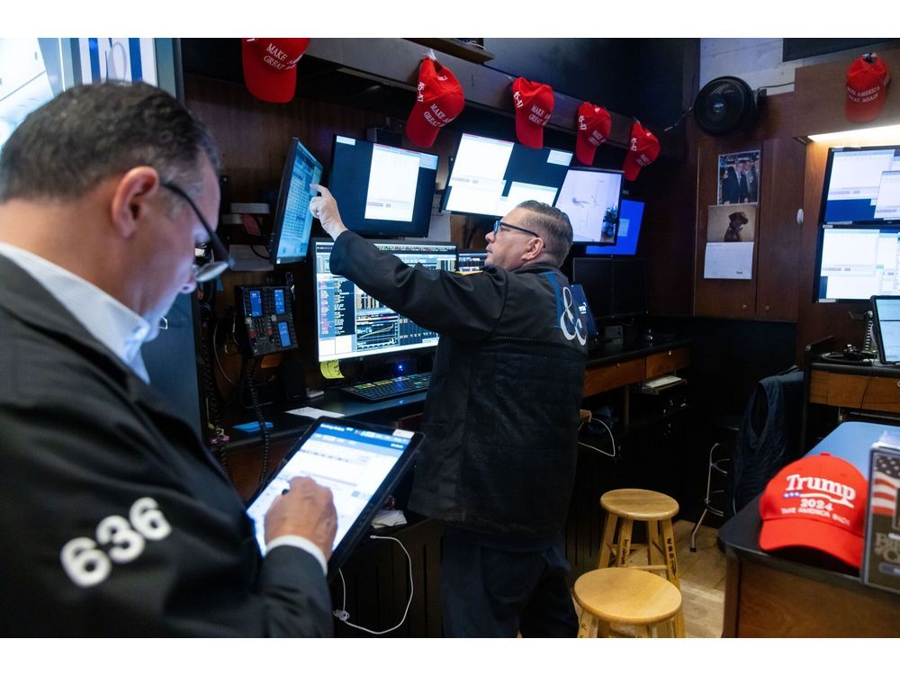 "Make American Great Again" hats as traders work on the floor of the New York Stock Exchange.