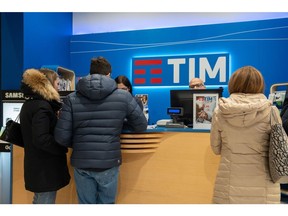Customers in a TIM SpA store, operated by Telecom Italia SpA, in Brescia, Italy, on Friday, Dec. 20, 2024. CVC Capital Partners Plc is exploring a potential purchase of Vivendi SE's stake in Telecom Italia SpA possibly paving the way for a takeover of Italy's biggest telecommunications company. Photographer: Francesca Volpi/Bloomberg