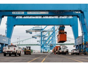 A container is loaded onto the Columbia Elizabeth barge at the Packer Avenue Marine Terminal at the Port of Philadelphia in Philadelphia, Pennsylvania, US, on Wednesday, March 5, 2025. The dollar dropped the most since US President Donald Trump took office this year as concerns about the negative impact of US tariffs on the economy weigh on the greenback, with losses particularly stark against the euro. Photographer: Hannah Beier/Bloomberg