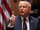 U.S. President Donald Trump calls on journalists to raise questions at a cabinet meeting in Washington, D.C. on March 24