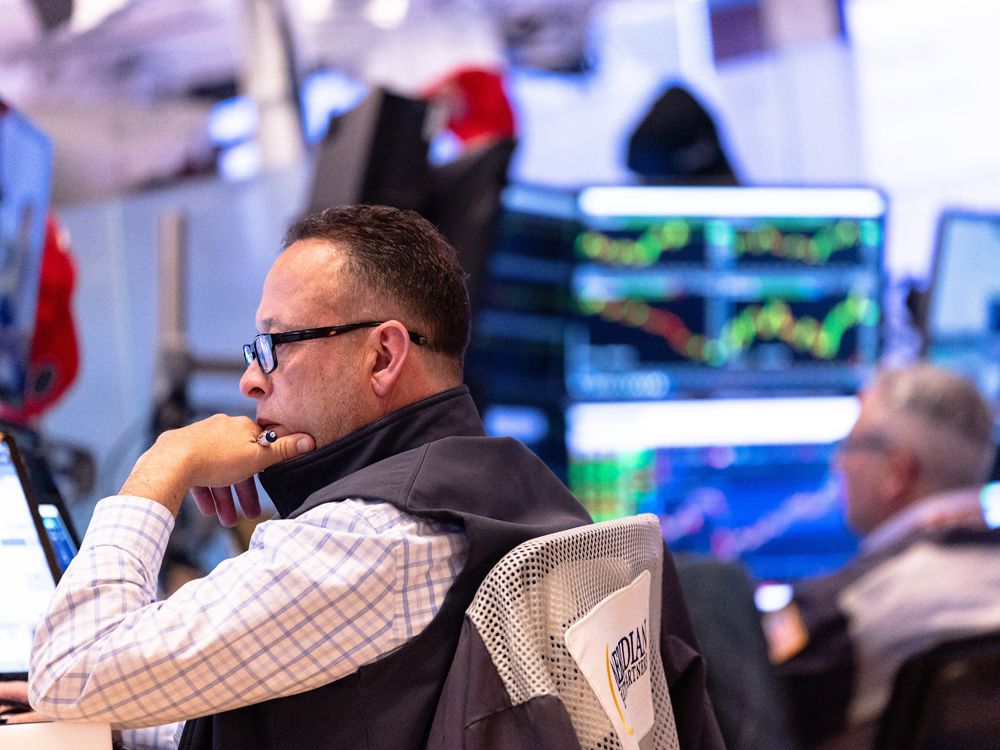 Traders work on the floor of the New York Stock Exchange during morning trading in New York City.