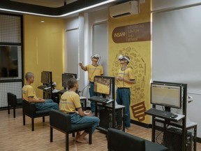 Students learn heavy machinery maintenance through virtual reality at United Tractors in Jakarta, Indonesia, on Thursday, March 6, 2025.