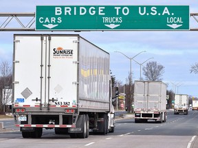 Trucks approach the Canada/U.S. border crossing in Windsor, Ont.