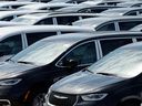 Chrysler Minivans that were assembled at the Stellantis Windsor Assembly Plant sit in a storage lot nearby in Windsor, Ontario, on April 3, 2025.