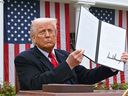 U.S. President Donald Trump held the signed executive order after commenting on reciprocity tariffs at an event in the White House Rose Garden in Washington, D.C. on April 2, 2025.