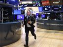 A trader runs on the floor of the New York Stock Exchange on April 3 as stocks plunged in response to President Donald Trump's tariff announcement.