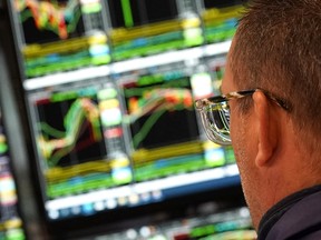 A trader works on the floor of the New York Stock Exchange (NYSE) at the opening bell on May 8, 2025.