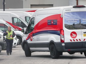 Canada Post employees are shown at the Walker Road facility in Windsor on Dec. 17, 2024.