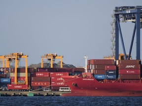 FILE - A container ship is docked at a cargo terminal in Tokyo, on April 9, 2025.