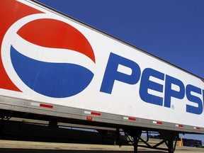 FILE - In this photo taken May 16, 2011, the Pepsi logo is seen on a delivery truck at Walmart in Springfield, Ill.