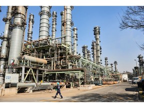 A worker in the octene and hexene solvents zone at Sasol Ltd.'s main plant which uses gasification to make fuel, in Secunda, Mpumalanga, South Africa, .