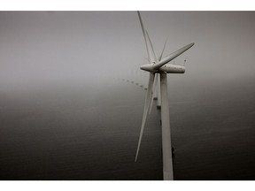 Offshore wind turbines at the Middelgrunden wind farm off the coast of Copenhagen, Denmark, on Thursday, Jan. 26, 2023. The wind farm off the coast of Denmark gives tour groups the rare opportunity to actually climb a turbine.