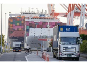 The Wan Hai 331 container ship, operated by Wan Hai Line Ltd., right, and Posorja Express container ship, operated by Hapag-Lloyd AG, moored at a shipping terminal in Yokohama, Japan, on Tuesday, April 15, 2025. Japan is scheduled to release trade figures on April 17.