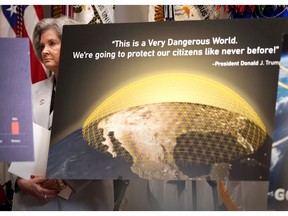 White House Chief of Staff Susie Wiles looks on from behind a chart on the Golden Dome missile defense system as U.S. President Donald Trump speaks during a press conference in the Roosevelt Room of the White House on May 12, 2025, in Washington, DC. During the event, President Trump signed an executive order aimed at reducing the cost of prescription drugs and pharmaceuticals by 30% to 80%.