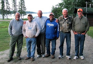 Gary Pullen, a retired Illinois corn and soybean farmer, poses with a bunch of buddies at Wildewood on Lake Savant, an American owned fishing lodge that caters to mostly American clients in northwestern Ontario. Gary is fourth from the left.