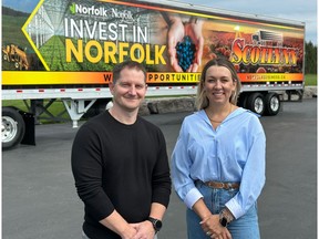 Brad Mitchell, Vice President of Scotlynn, and Norfolk County Mayor Amy Martin stand in front of one of the newly wrapped Scotlynn trailers featuring the