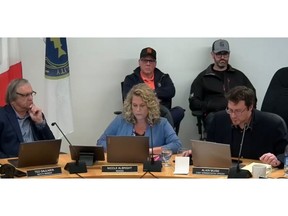 Nolan Deon, and Colton Deon from Deon's Oysters sit behind Deputy Warden Ted Saulnier, Warden Nicole Albright, and CAO Alain Muise during the March 20 session for the municipality of Argyle NS.