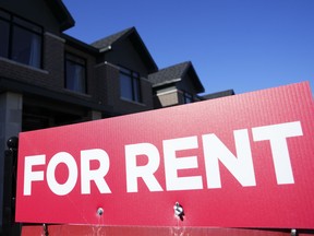 A for rent sign is displayed on a house in Ottawa on Oct. 14, 2022.