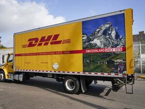 A DHL delivery truck passes a company facility Oct. 20, 2020, in New York.