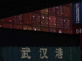 Stacked containers are seen at the Yangluo Port on the Yangtze River in Wuhan, central China's Hubei Province, Friday, May 23, 2025.